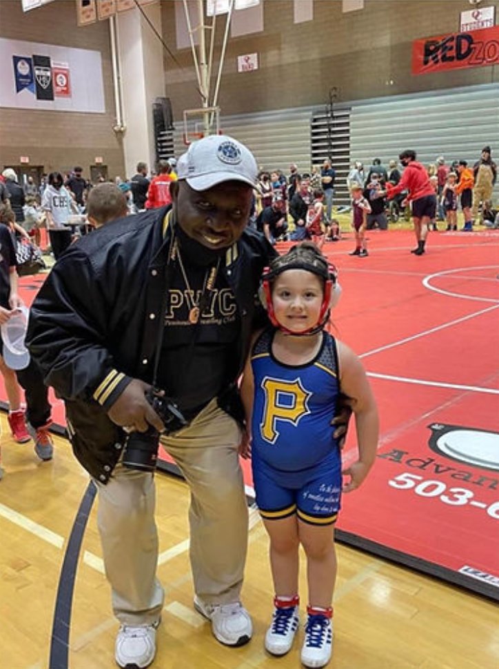 Coach Pittman with a young wrestler